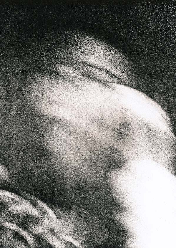 Lith print portrait emerging from grain, half in shadow